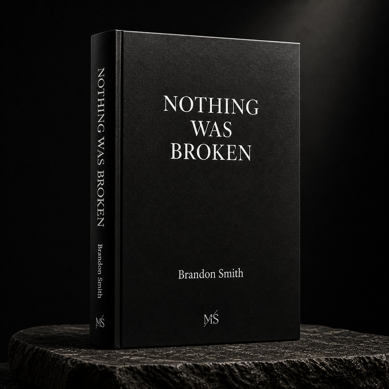 Nothing Was Broken — hardcover book by Brandon Smith on a dark stone surface